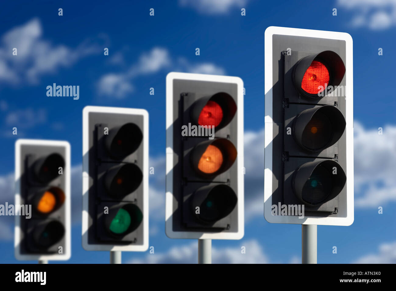 ROW OF FOUR ROAD TRAFFIC LIGHTS SHOWING SEQUENCE OF RED RED AND AMBER GREEN AND AMBER Stock Photo