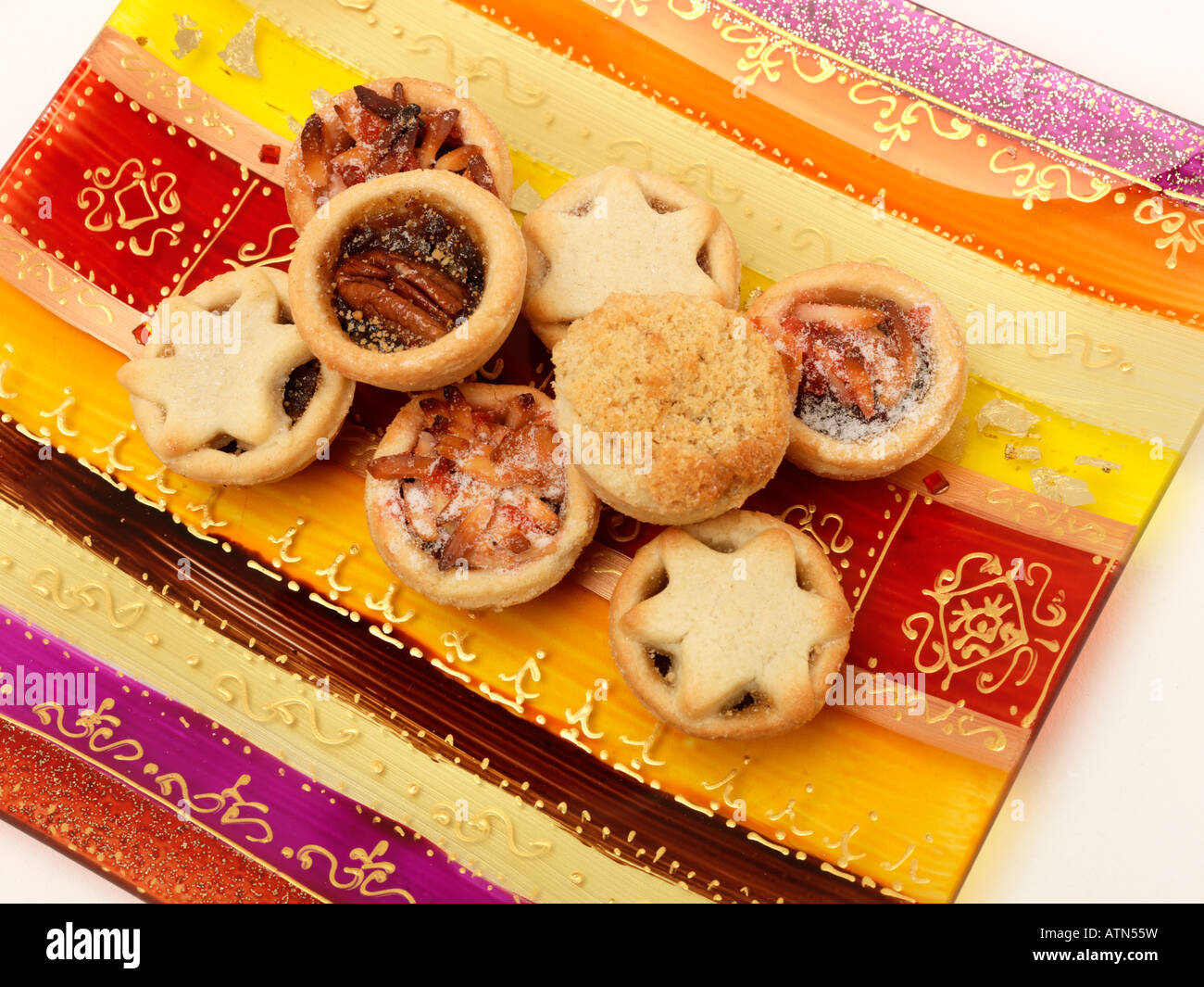 Mince Pies on a Colourful Glass Plate Stock Photo