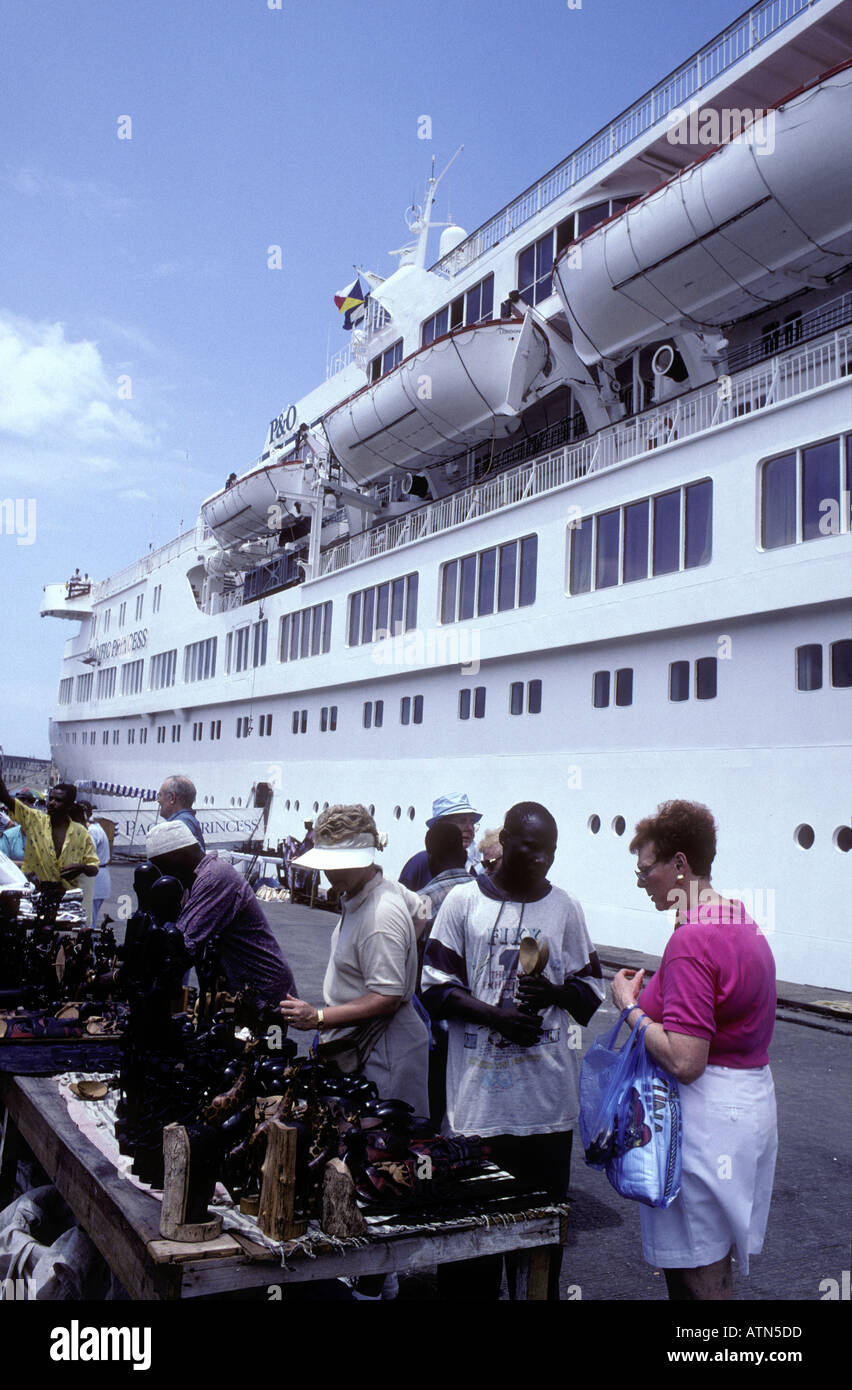 Passengers from an ocean cruise ship bargaining on the dock Zanzibar