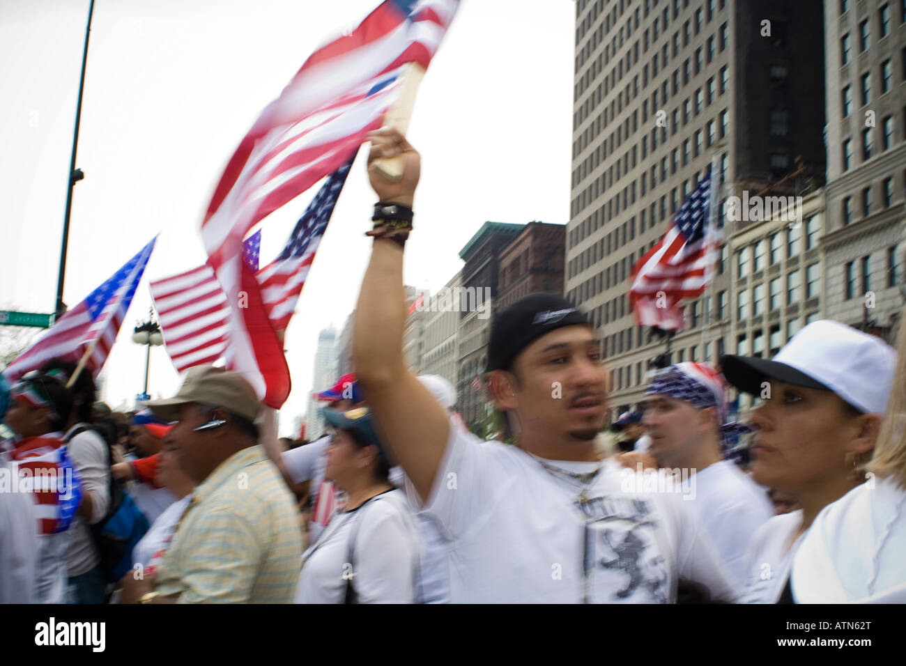 Hispanic men and women marching in a protest Chicago Illinois Stock Photo