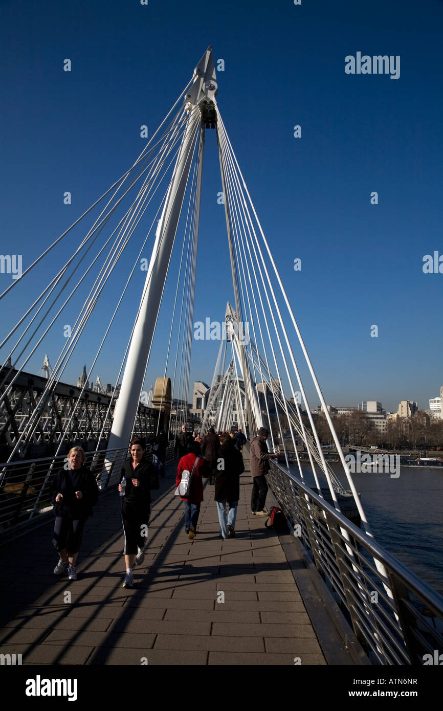 People Crossing Golden Jubilee Bridge River Thames London England Stock Photo