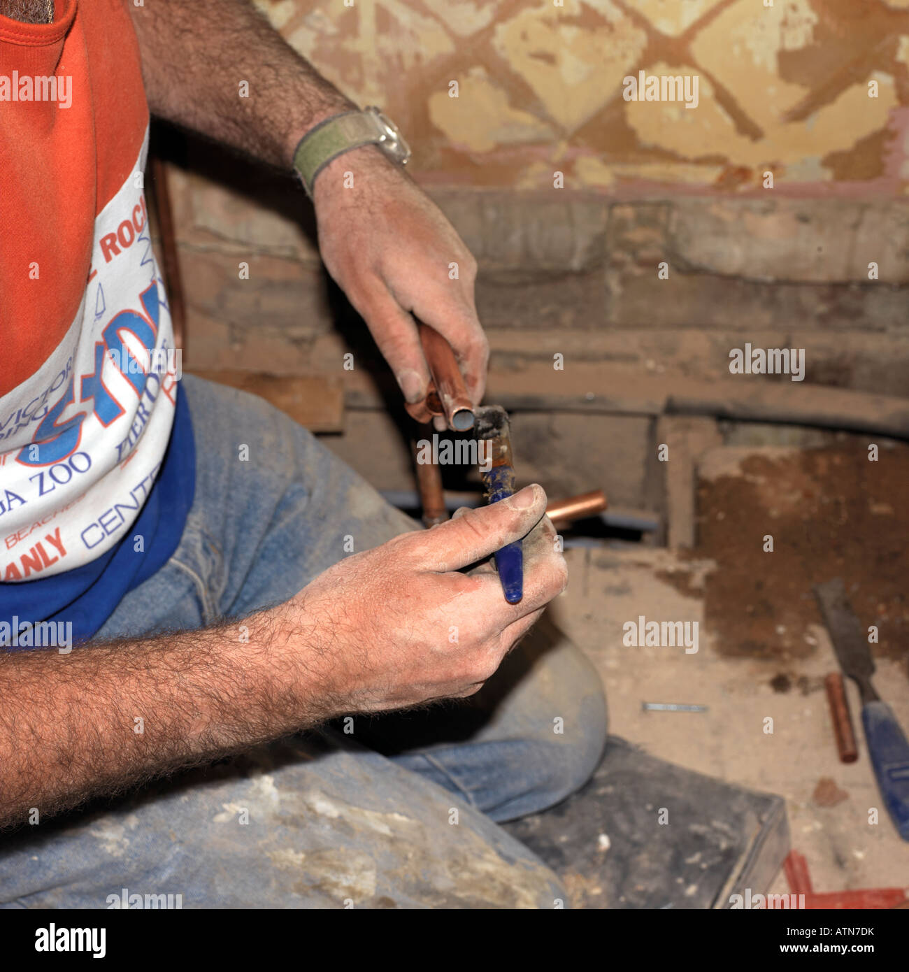 Plumber putting Sealant on a Copper Pipe Stock Photo Alamy