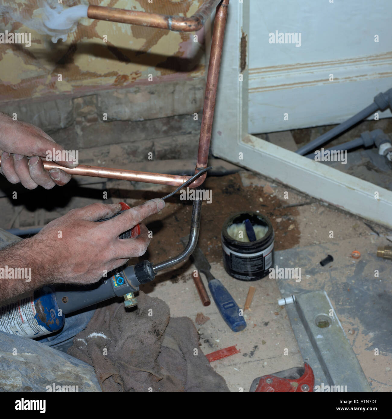 Plumber soldering a Copper Pipe Stock Photo Alamy