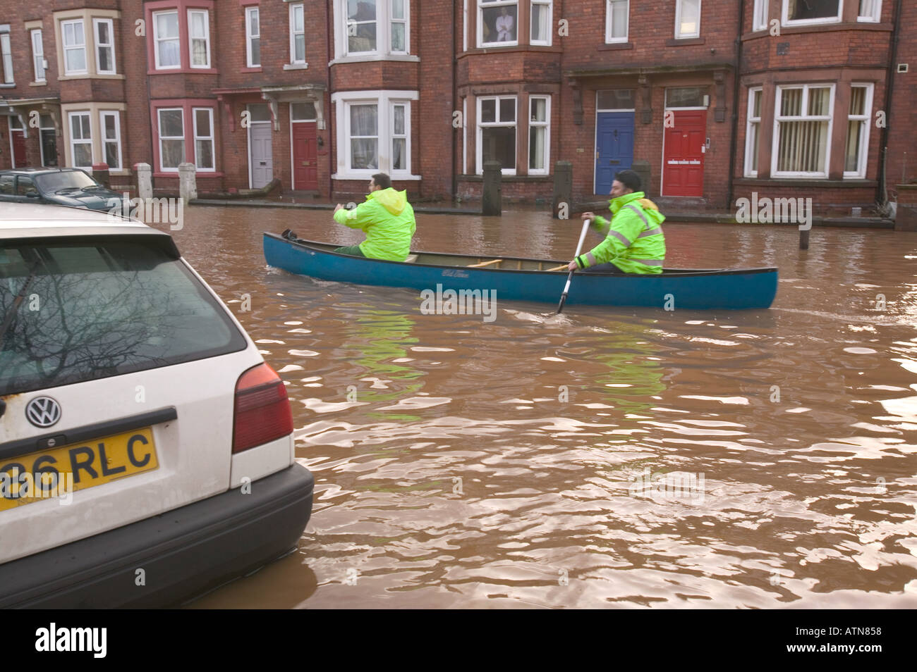 rescue workers canoe down Warwick road in the Carlisle floods Stock