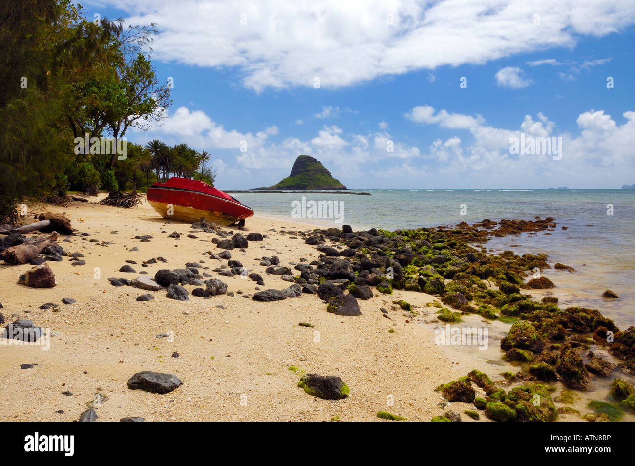 The sandy beach at the Kualoa Park with Chinaman s Hat Island in the