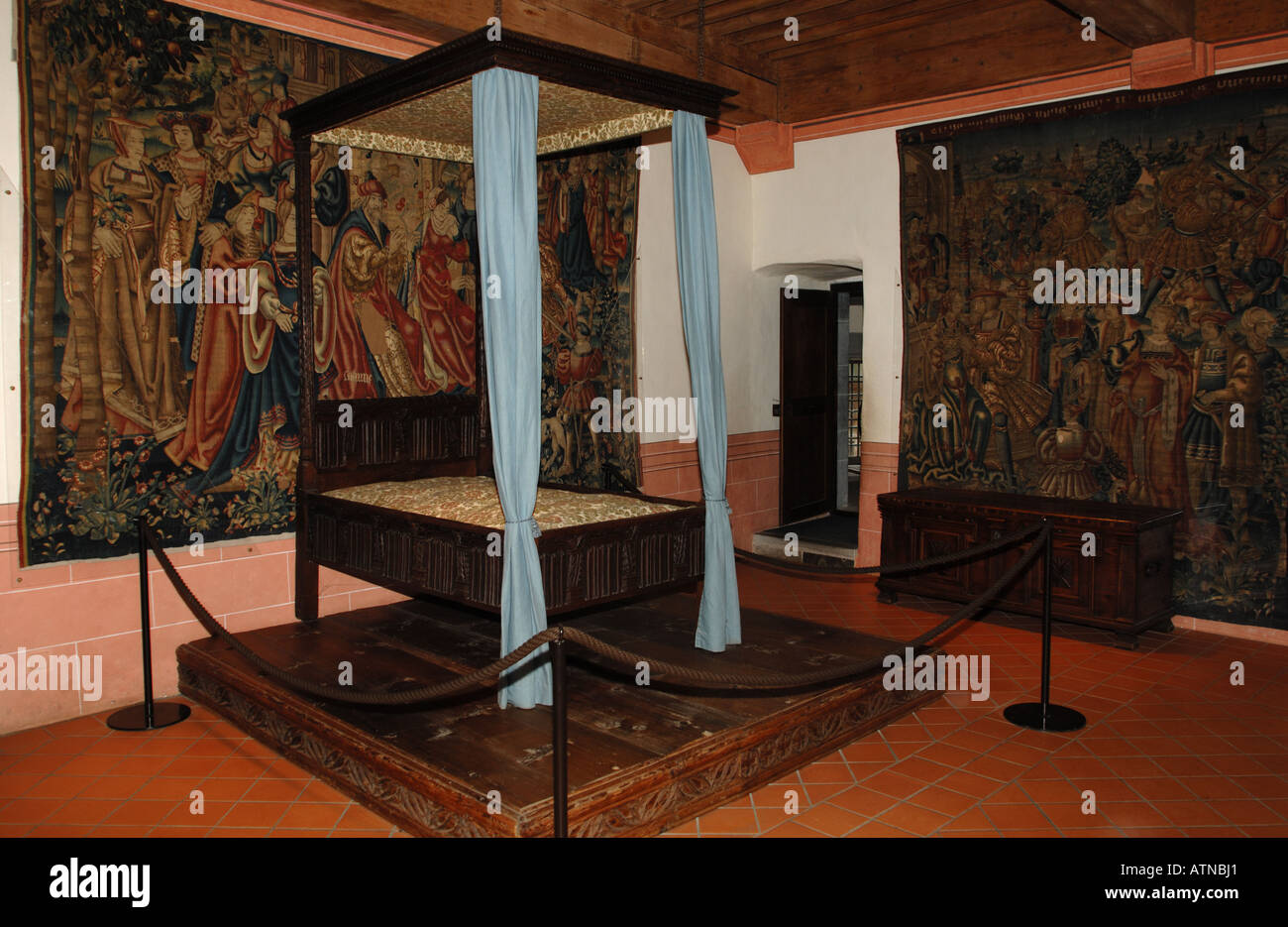 Four poster bed and Flemish tapestries in Count s room Gruyéres Chateau Switzerland Stock Photo