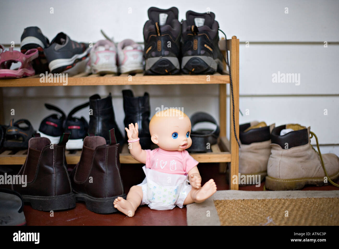 doll-and-shoe-rack-stock-photo-alamy