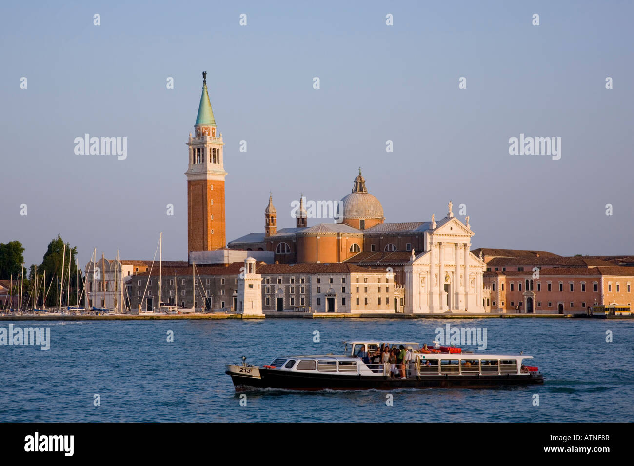 Venice, Veneto, Italy. View across the lagoon to the Chiesa di San Giorgio Maggiore, vaporetto in foreground. Stock Photo