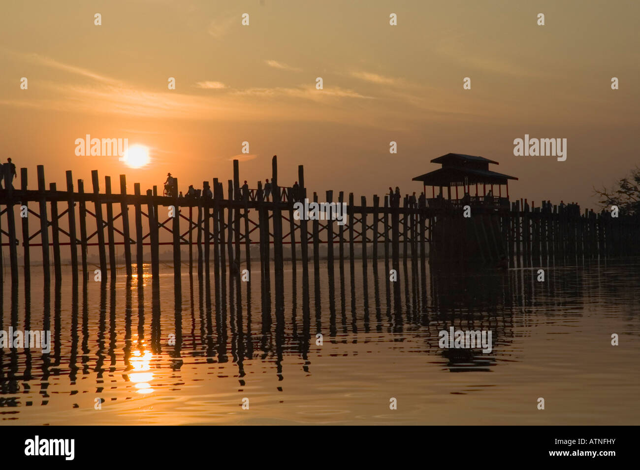 Silhouette of U Bein's Bridge at sunset Ayeyarwady River Amarapura near ...