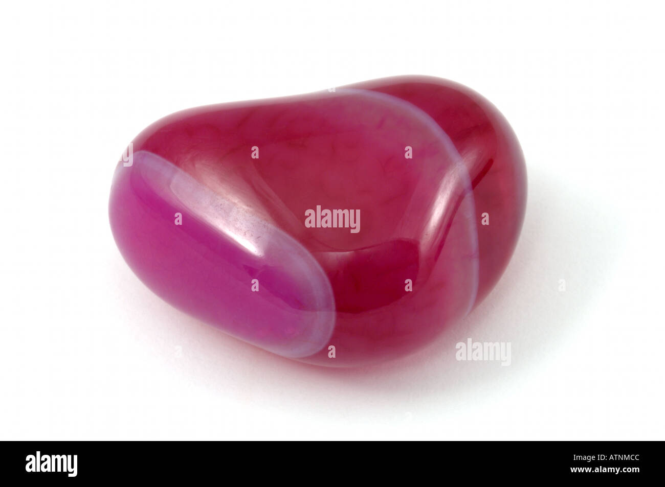 Heart shaped Pink agate on white background Stock Photo