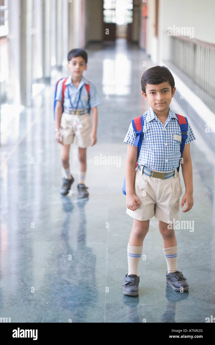 Portrait of a boy standing in the corridor of a school Stock Photo - Alamy