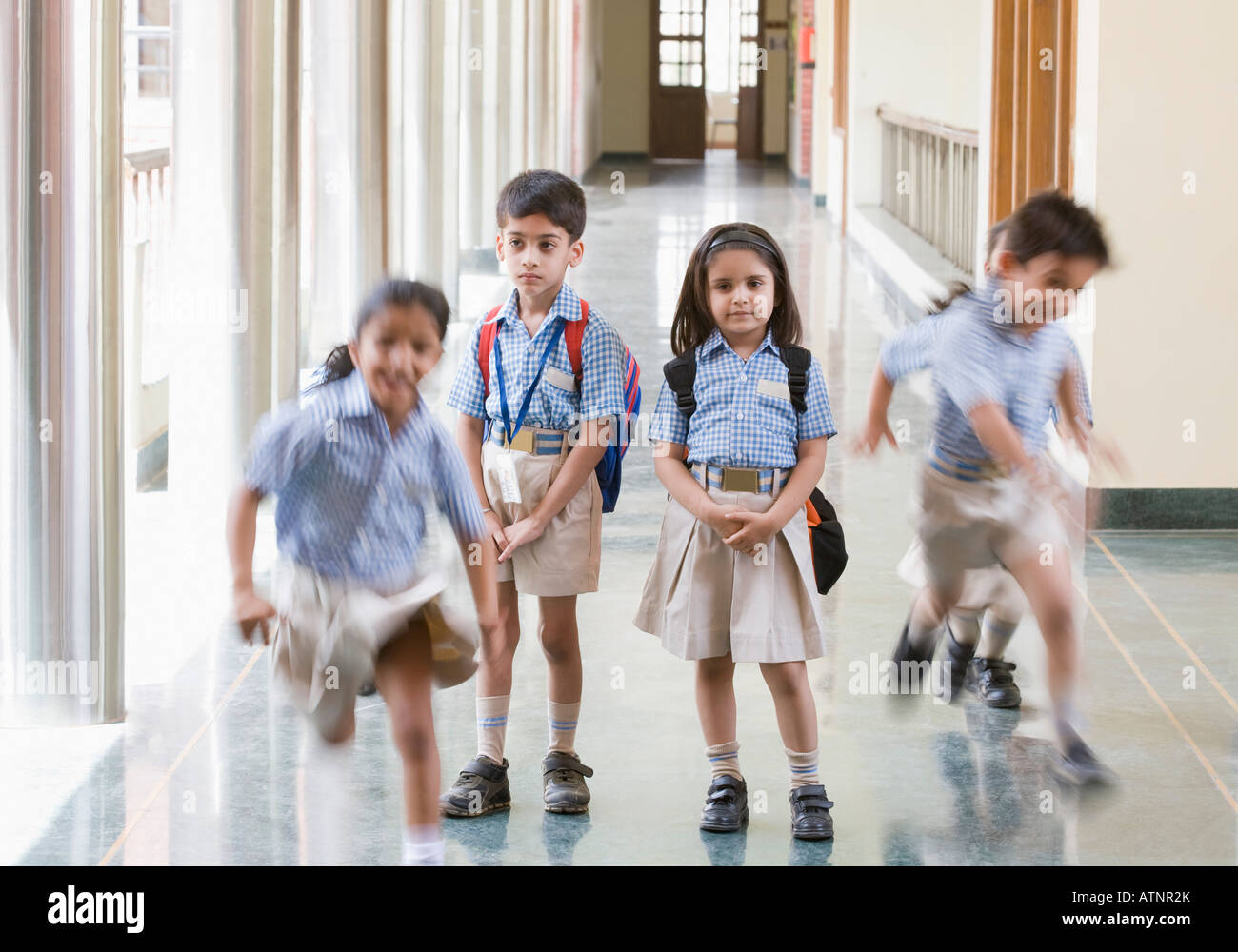 Students at the corridor of a school Stock Photo - Alamy