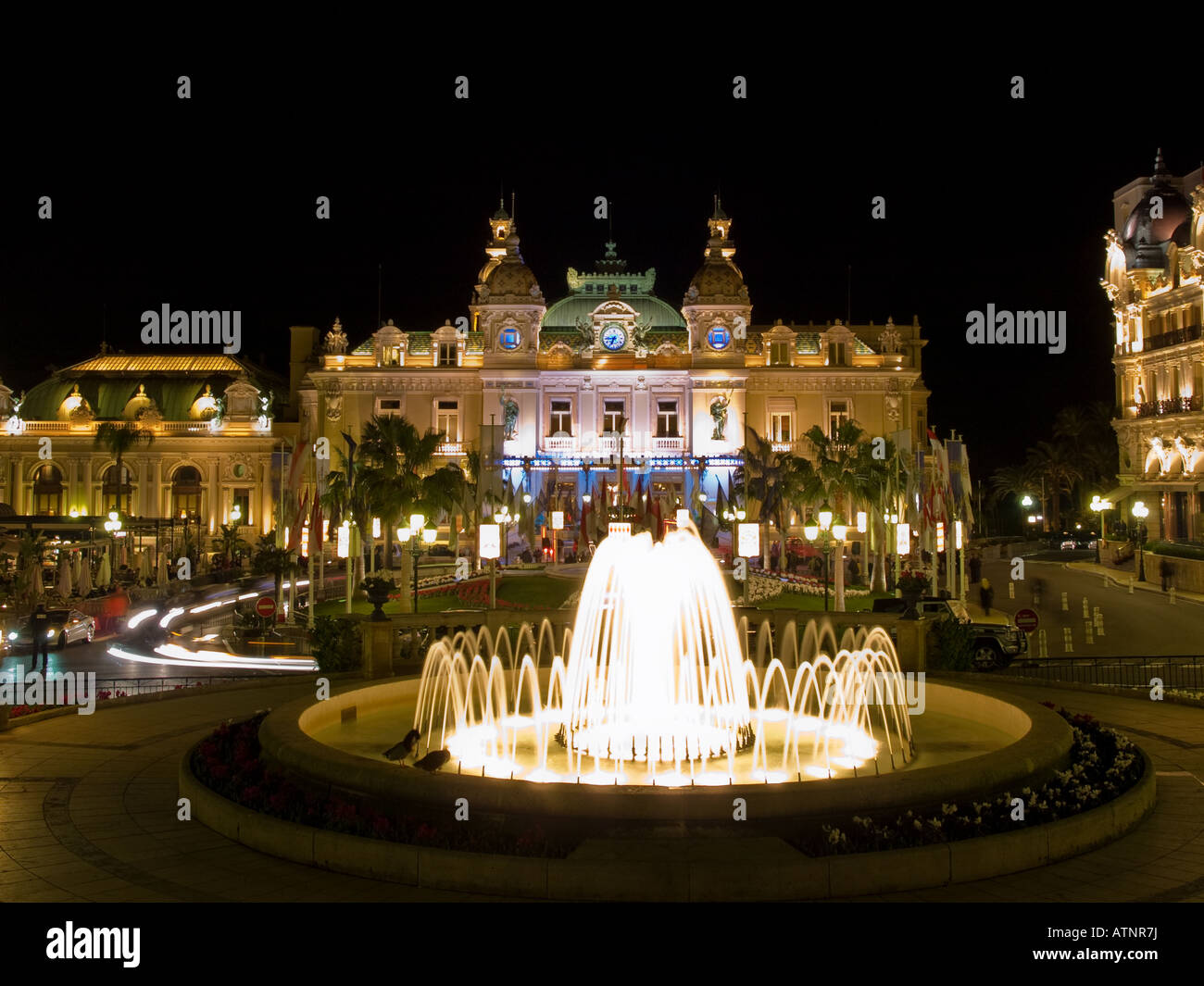 The highrolling, famous Monte Carlo Casino at night. Monaco Stock