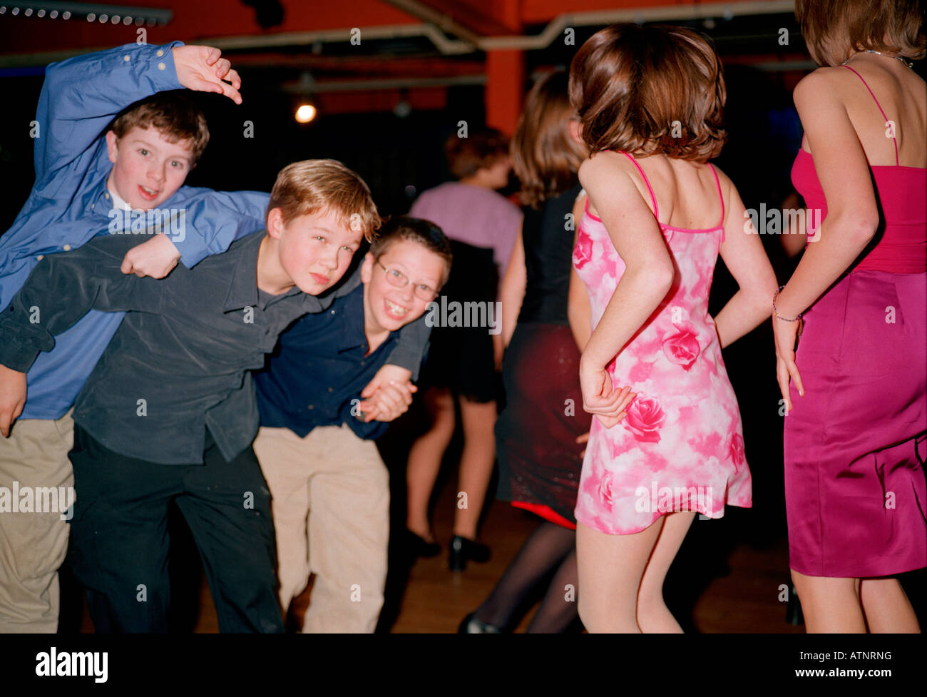 Ed Sweet, Harry Bucknall and Jack Robinson educated at Dulwich College Prep lark about on the dance floor. Stock Photo