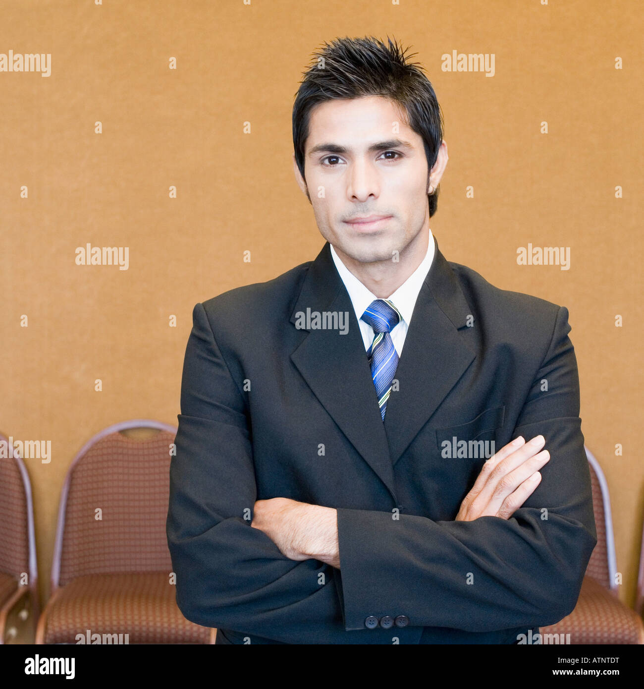 Portrait of a businessman standing with his arms crossed Stock Photo ...