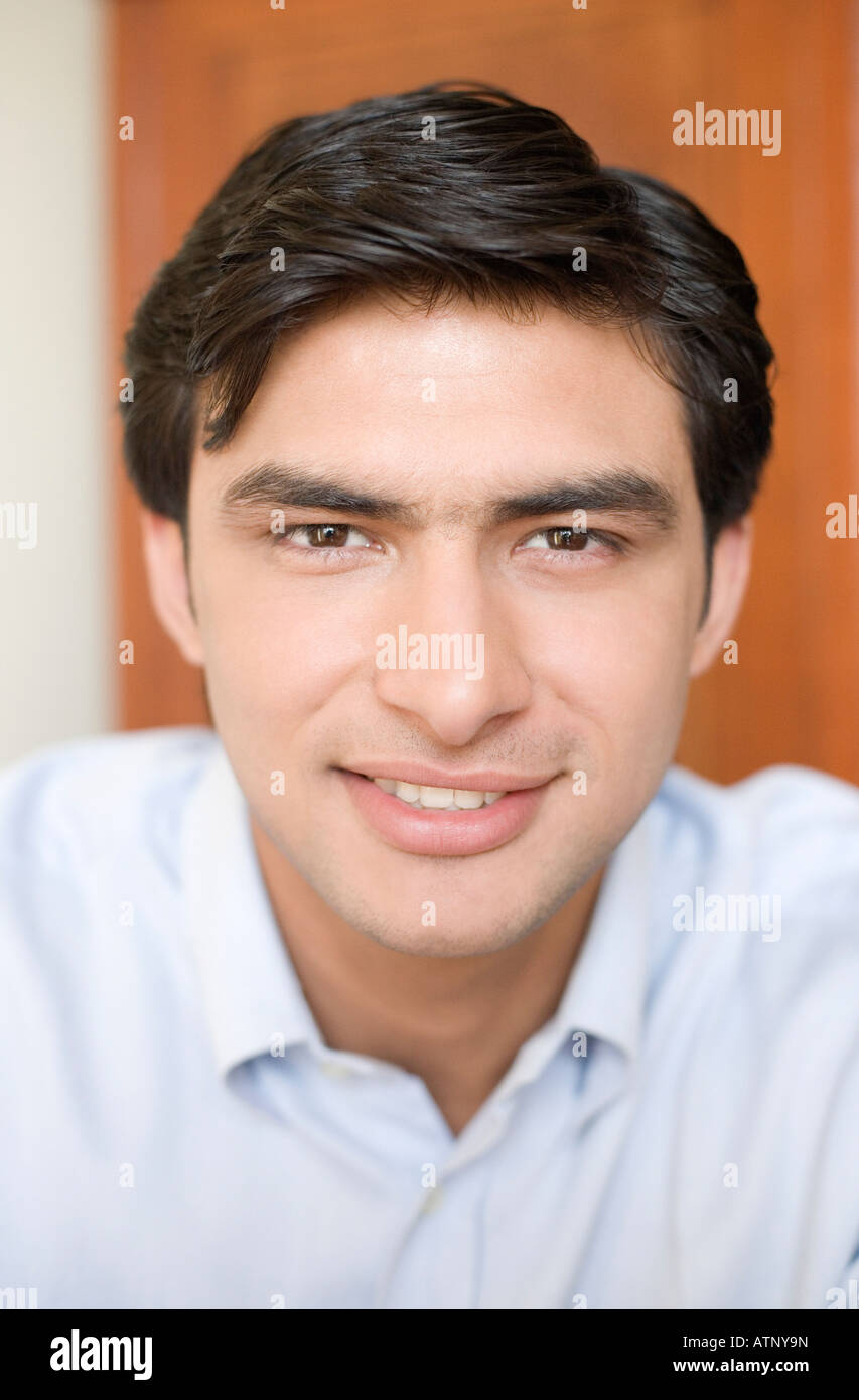 Portrait of a young man smiling Stock Photo - Alamy