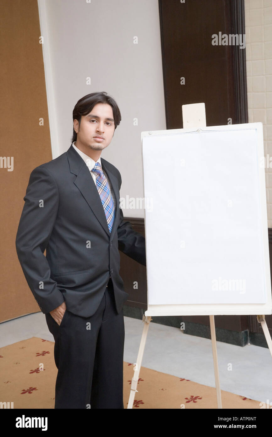 Portrait of a businessman standing near a whiteboard Stock Photo - Alamy