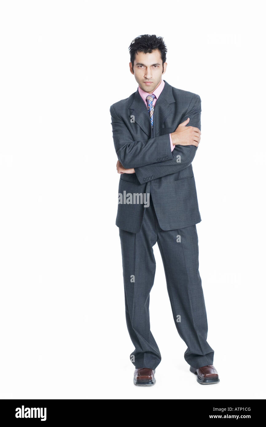 Portrait of a businessman standing with his arms crossed Stock Photo ...