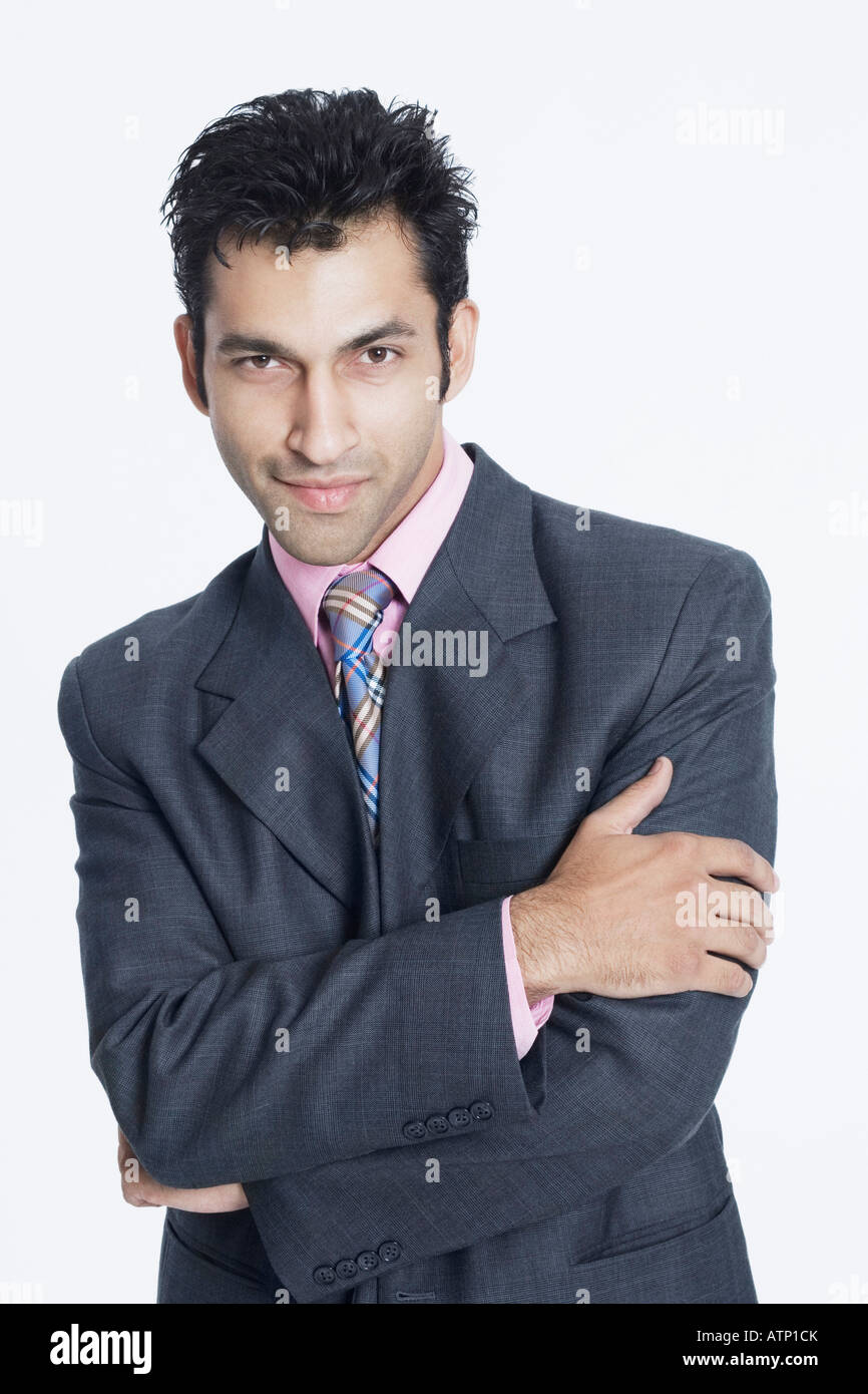 Portrait of a businessman standing with his arms crossed Stock Photo ...