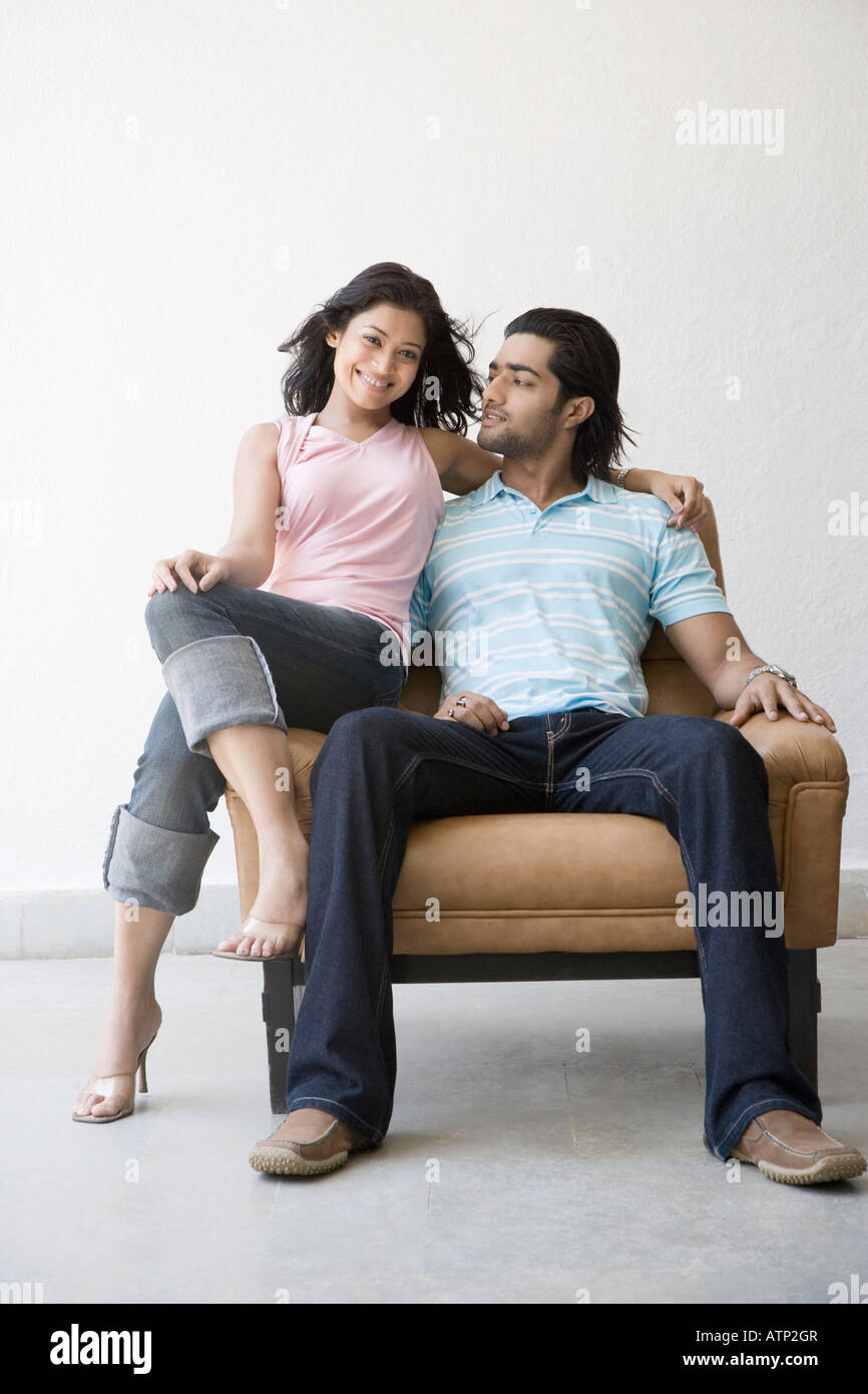 Excited black couple sitting hi-res stock photography and images - Alamy