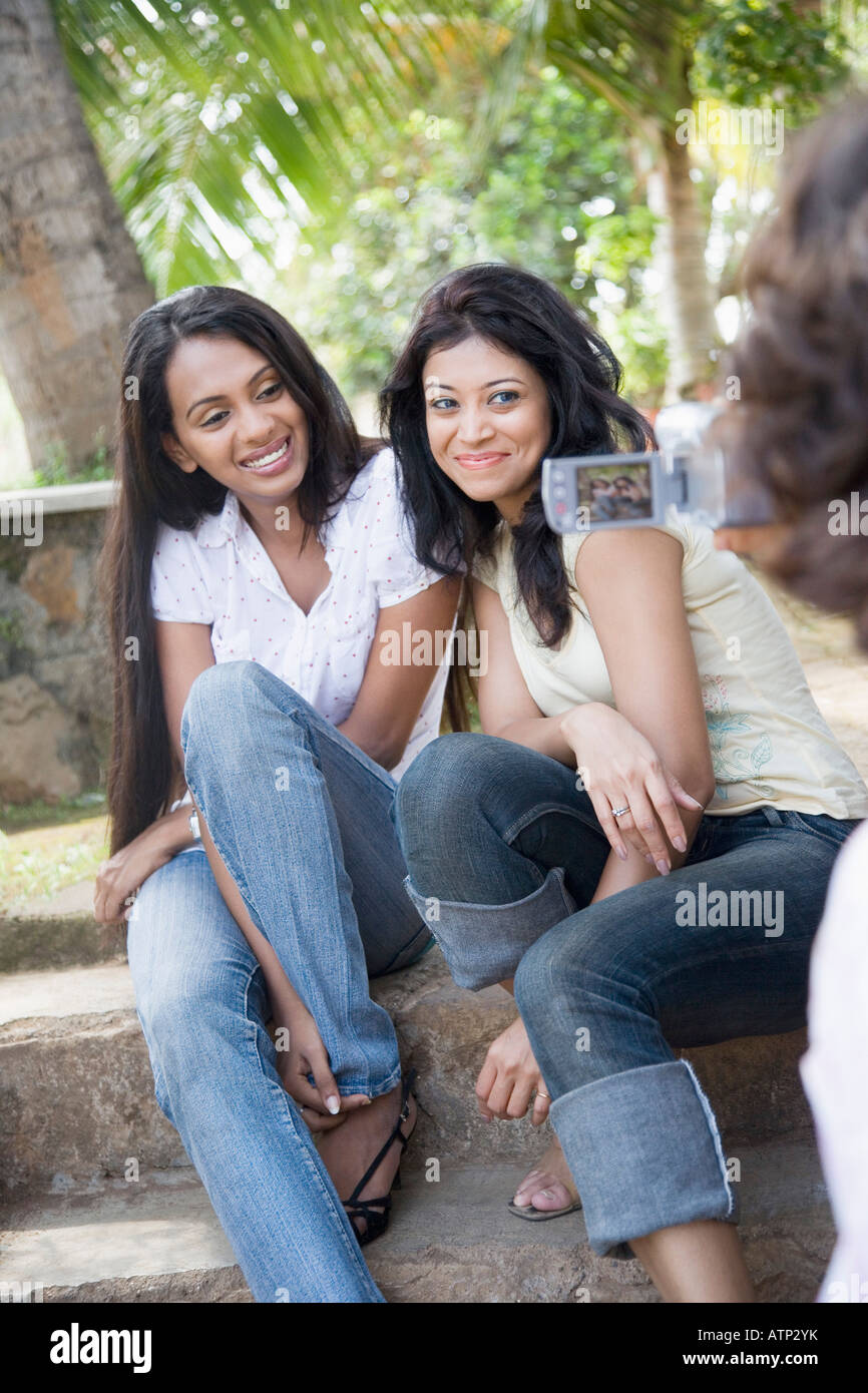 Two women in park sitting hi-res stock photography and images - Alamy