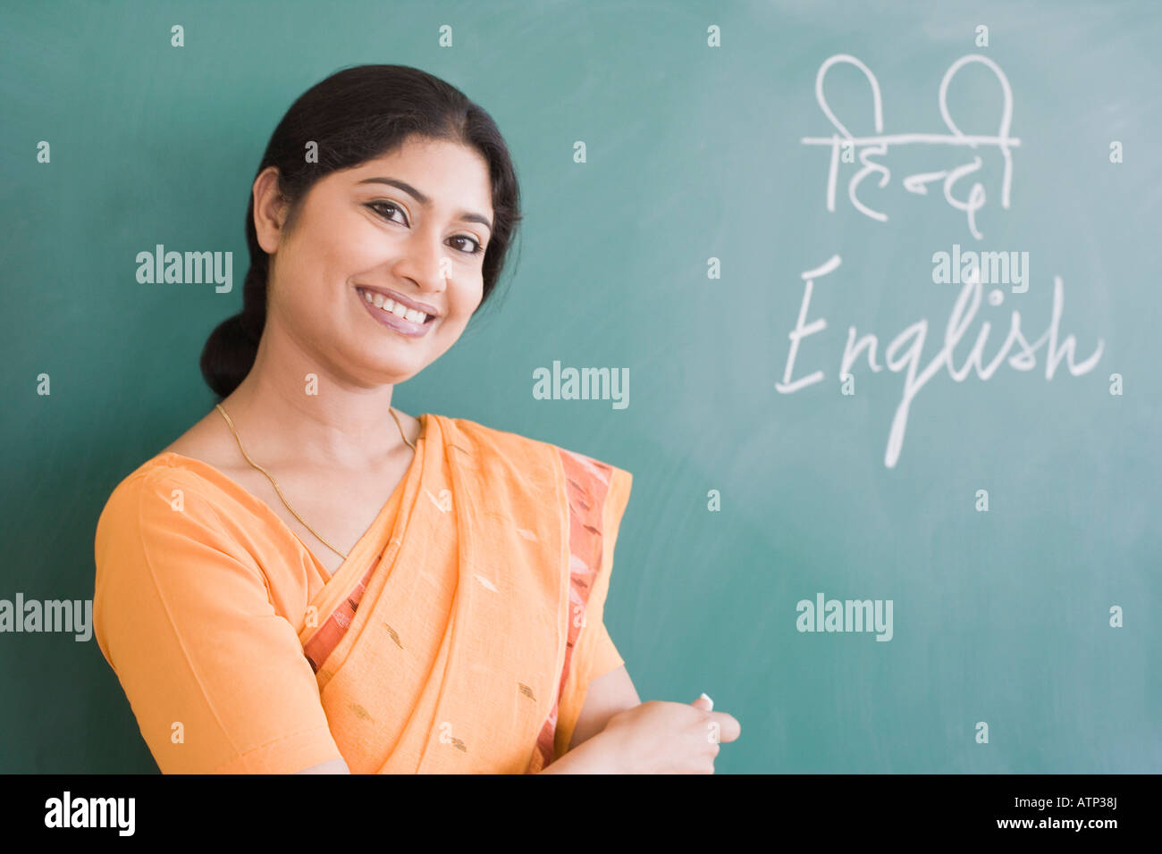 Portrait of a school teacher smiling Stock Photo - Alamy