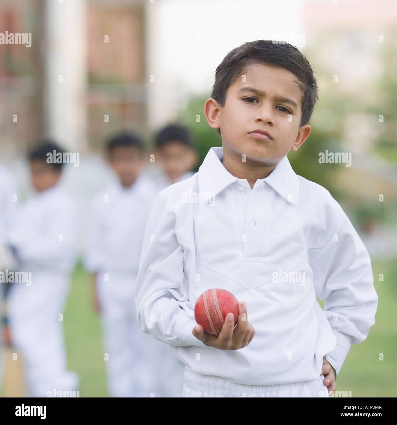 Portrait of a boy holding a cricket ball Stock Photo Alamy