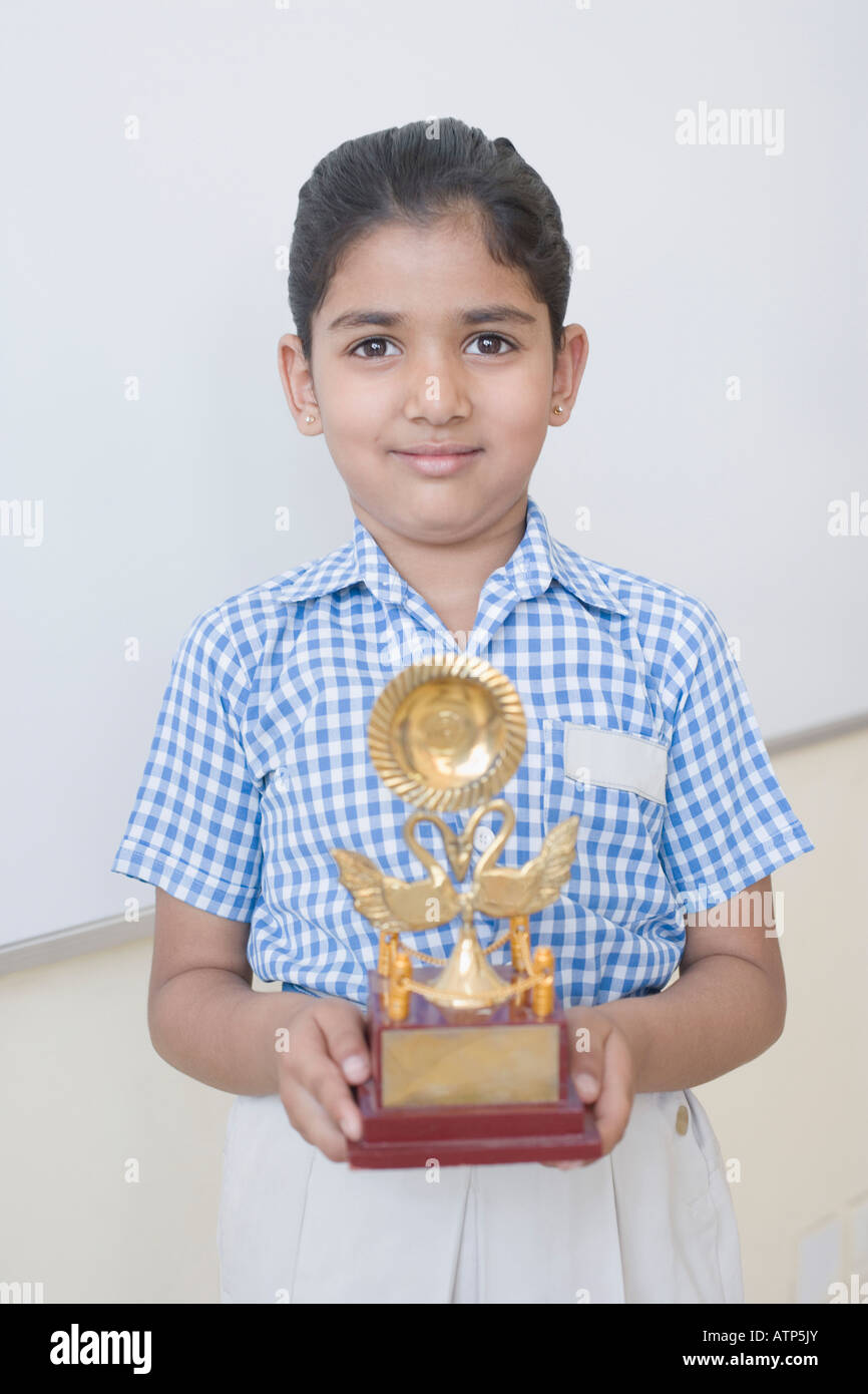 Primary school girl holding trophy hi-res stock photography and images ...