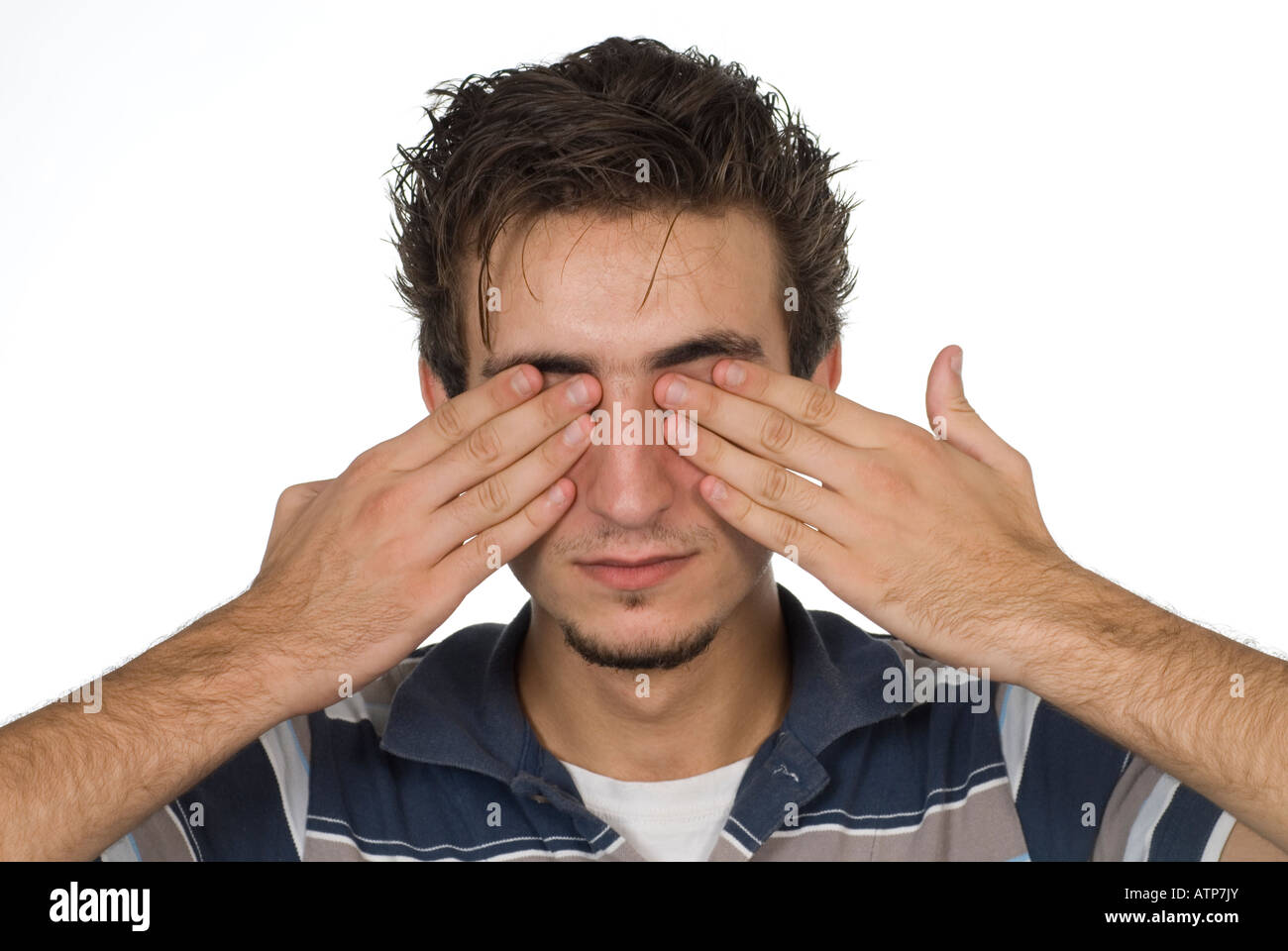 Teenager covering eyes with his hands Stock Photo Alamy