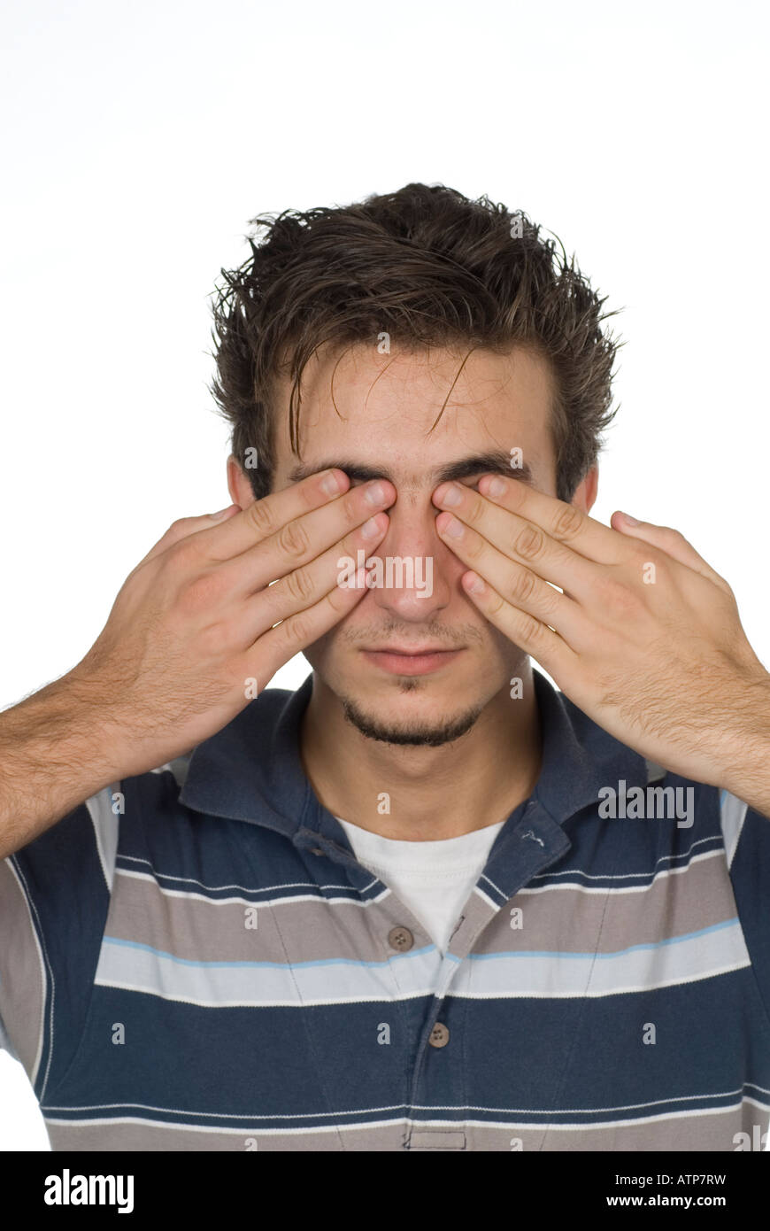 Teenager covering eyes with his hands Stock Photo Alamy