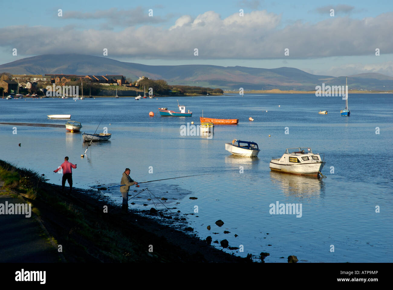 Angler trying his luck in the Walney Channel, between Walney Island and Barrow-in-Furness, Cumbria UK Stock Photo