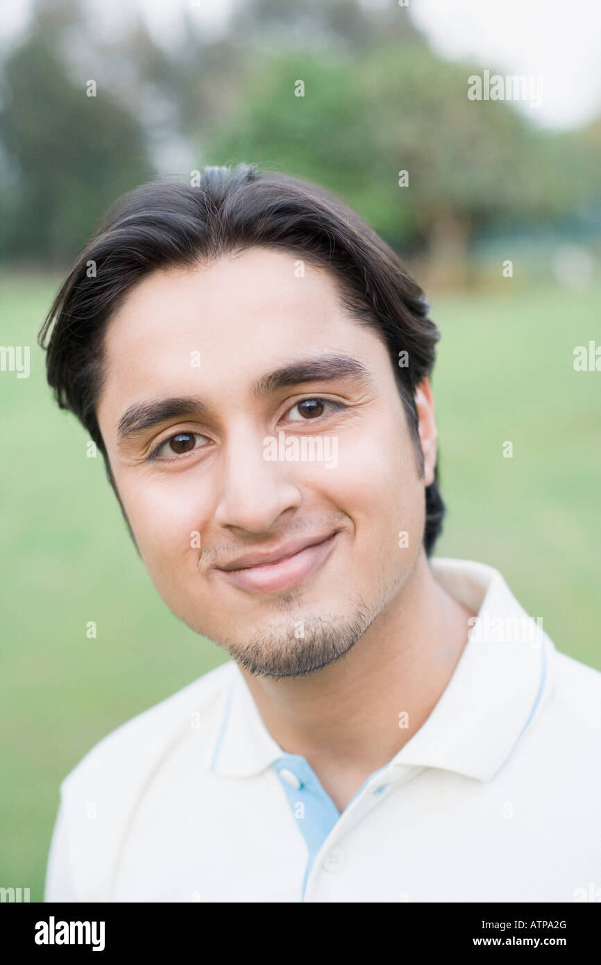 Portrait of a young man smiling Stock Photo - Alamy