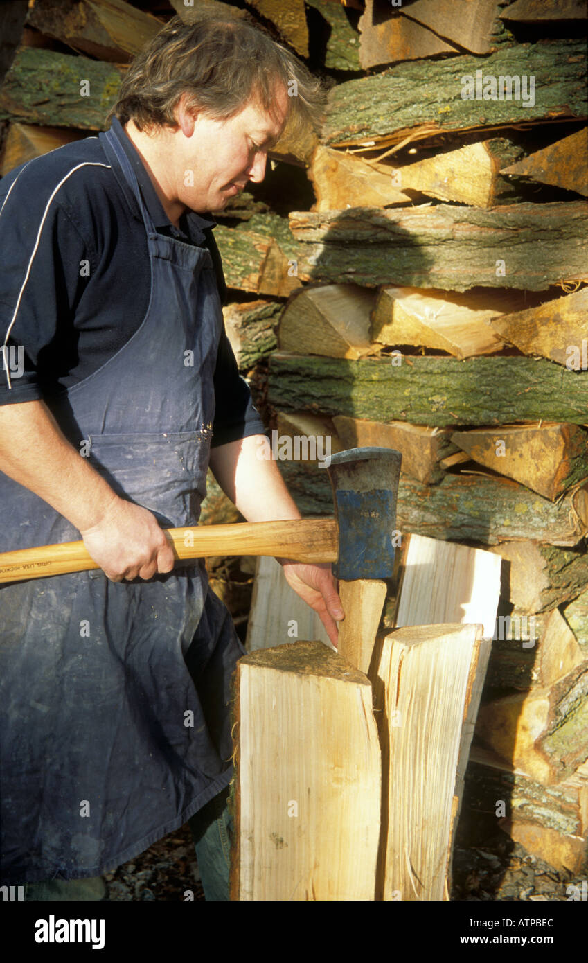 Traditional willow cricket bats by splitting willow logs with an axe at Ashburnham East Sussex Stock Photo