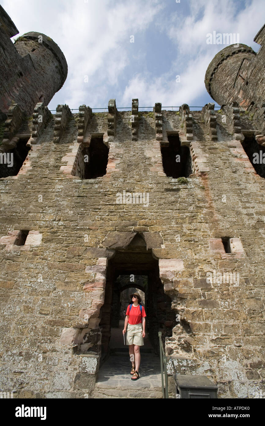 Female tourist entering the Inner Ward Conwy Castle Conwy Wales UK Stock Photo