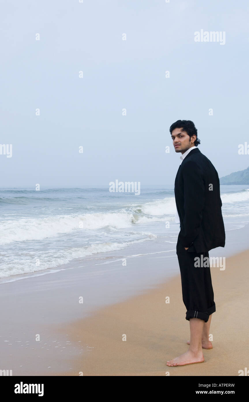 Beach Rode Side Profile Side profile of a businessman standing on the beach Stock Photo - Alamy