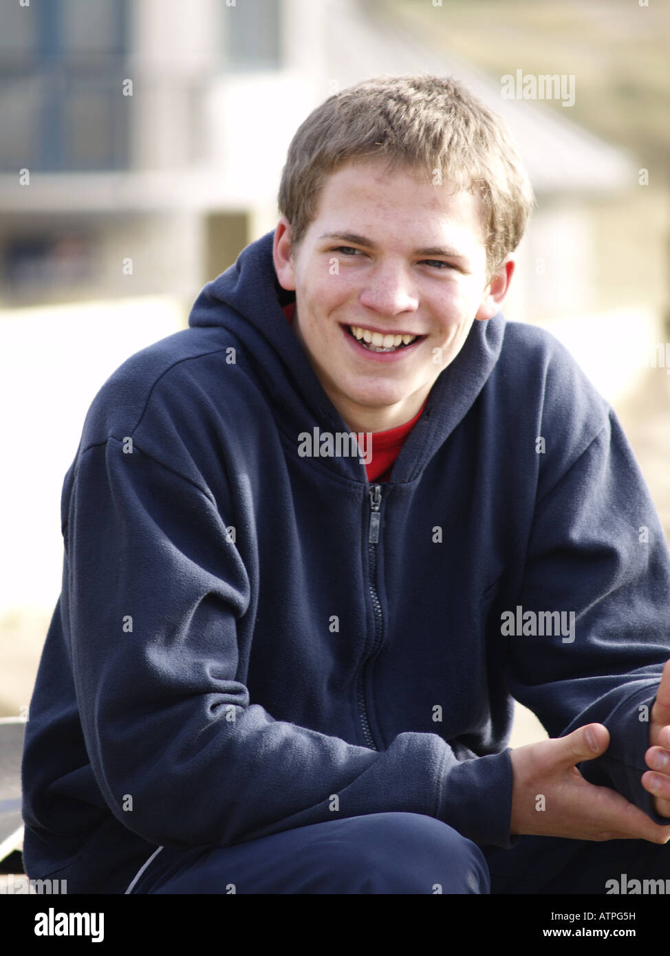 Teenage boy smiling Stock Photo - Alamy