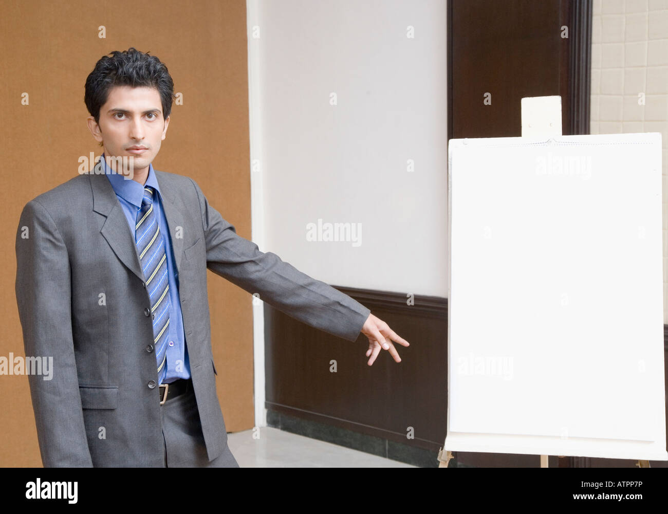 Pointing Near Portrait of a businessman standing near a whiteboard and pointing Stock ...