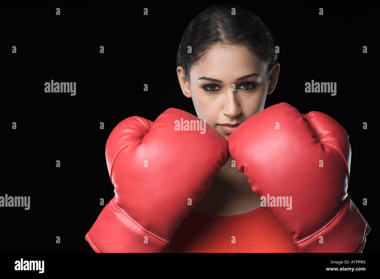 Portrait of a young woman wearing boxing gloves Stock Photo Alamy