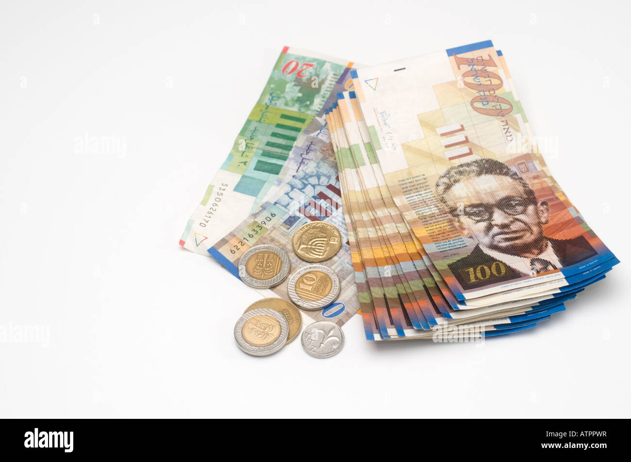 Israeli currency NIS New Israeli Sheqalim notes and coins on white background bank notes of 100