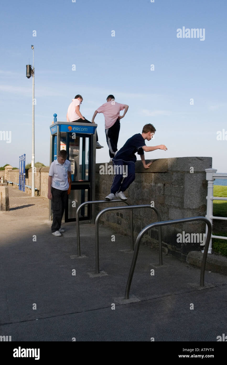 four young boys engaged in anti social behaviour Stock Photo