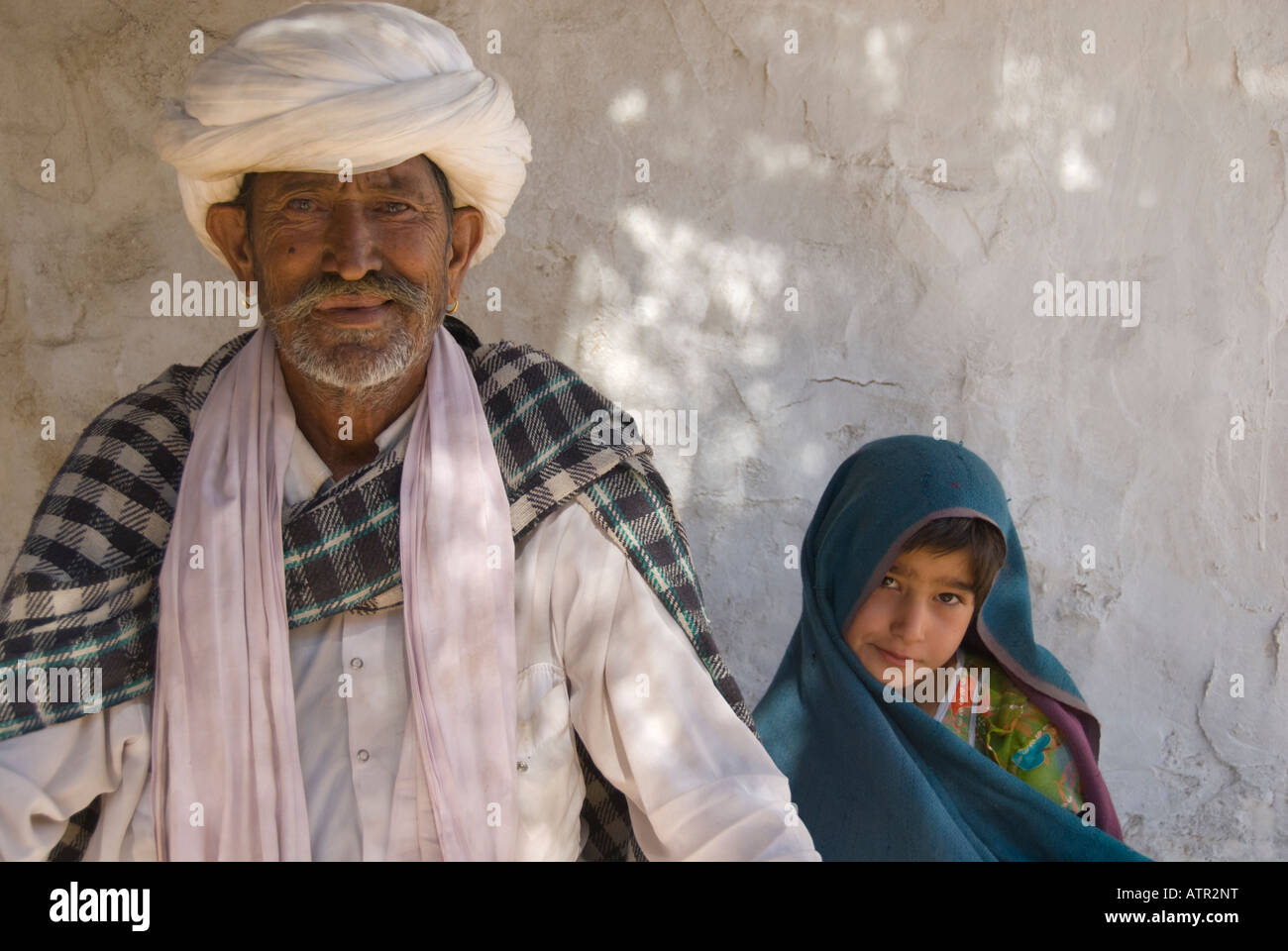 Portrait of a Proud Turbaned Muslim Grandfather with his Granddaughter Stock Photo