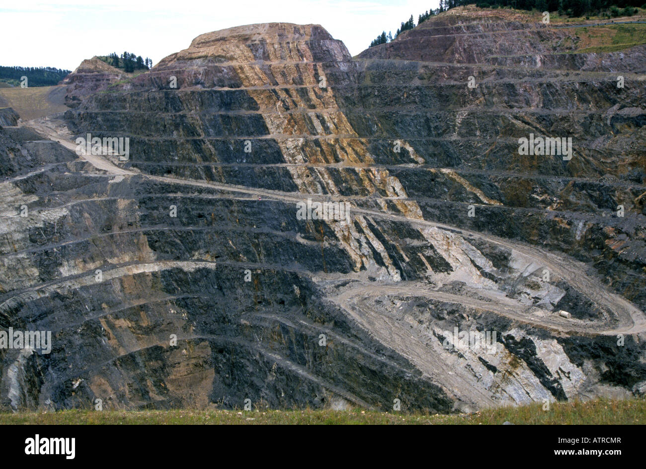 This is a large open pit gold and silver mine called the Gilt Edge Mine and sits near Deadwood in the Black Hills Stock Photo