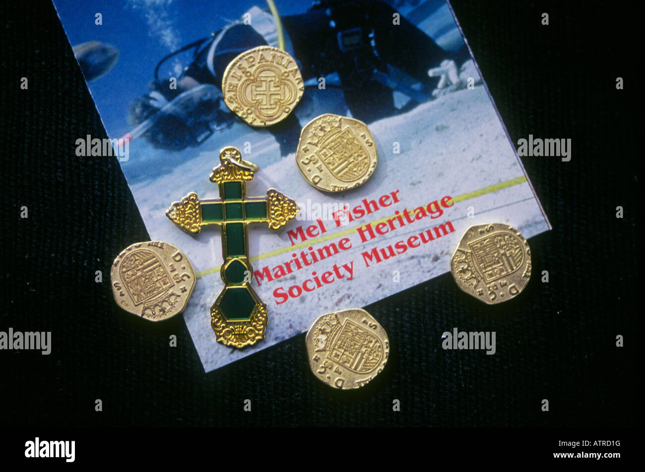 Gold Doubloons and a gold and emerald cross from the Atocha on display at Mel Fisher s Maritime Treasure Museum in Key WEst Stock Photo