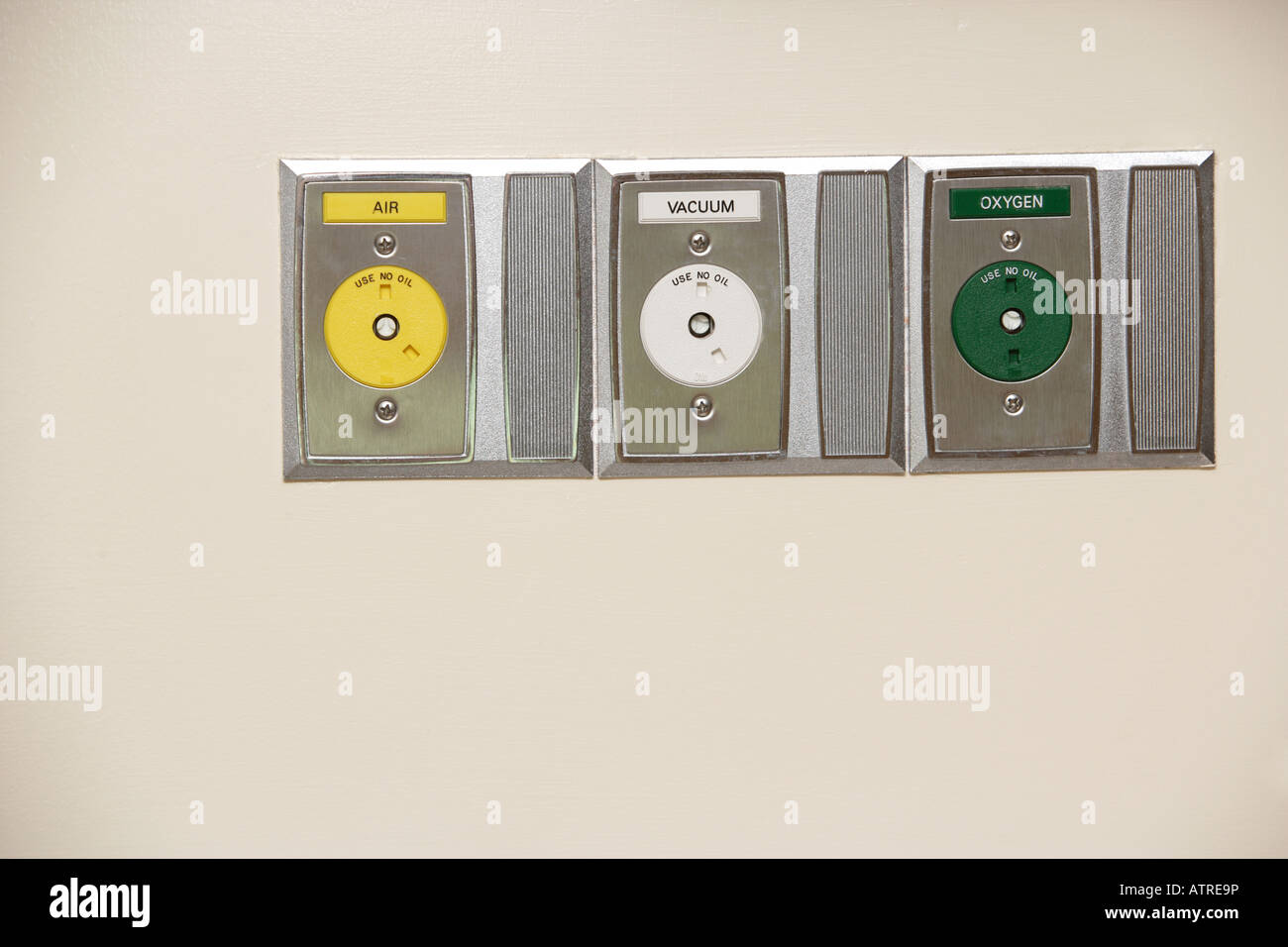 Three plugs for air vacuum and oxygen in a hospital Stock Photo