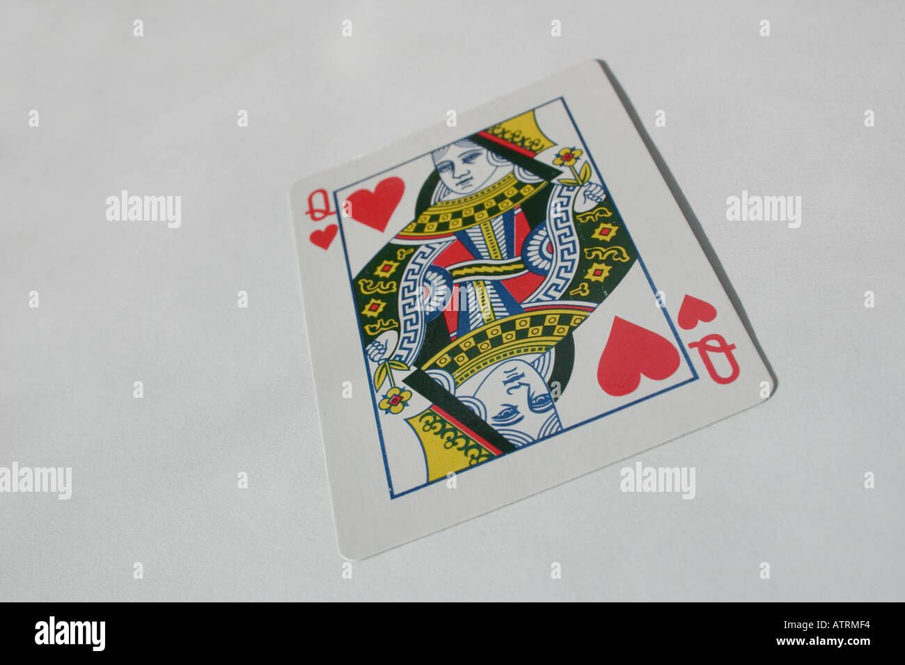Queen of hearts card from deck of cards on plain background Stock Photo ...