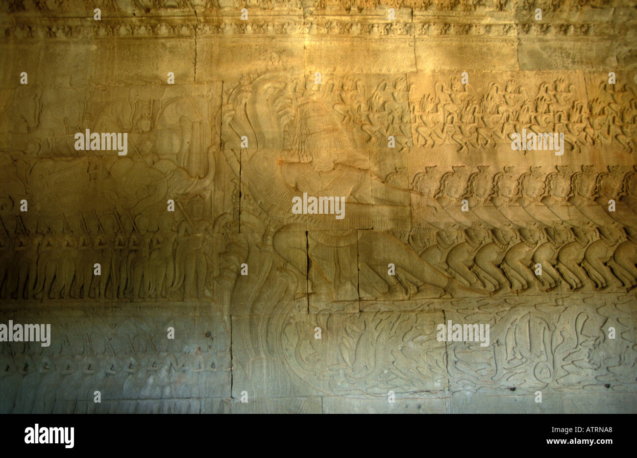 Angkor bas reliefs of Hindu myths at temple of Angkor Wat Stock Photo