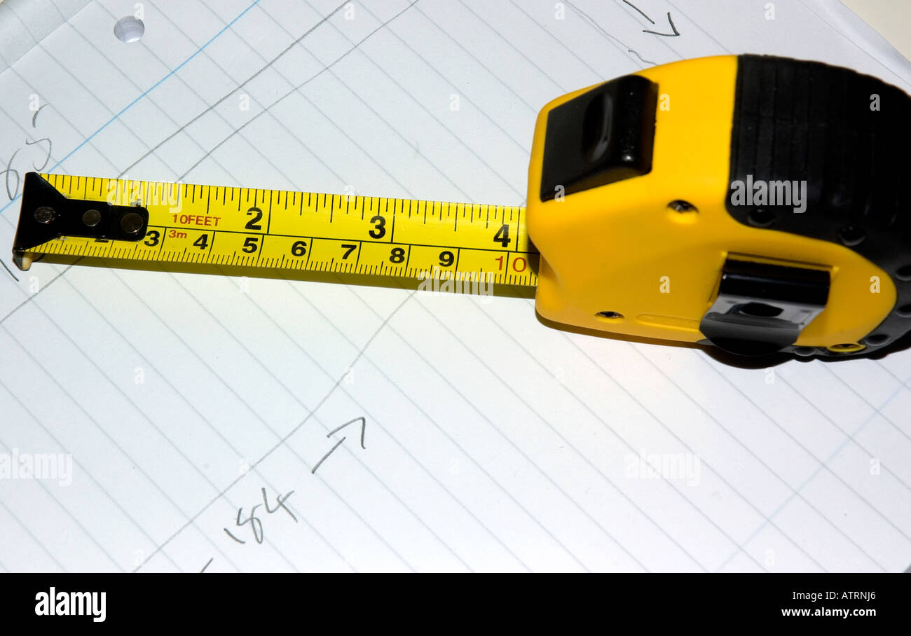 Yellow metal tape measure Stock Photo - Alamy