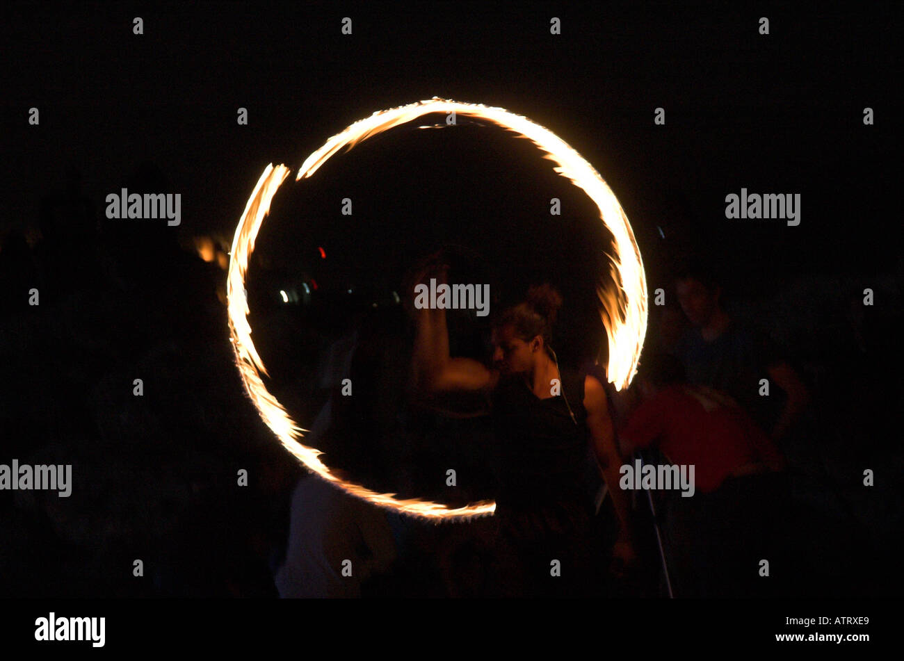 Man juggling fire night shot Stock Photo