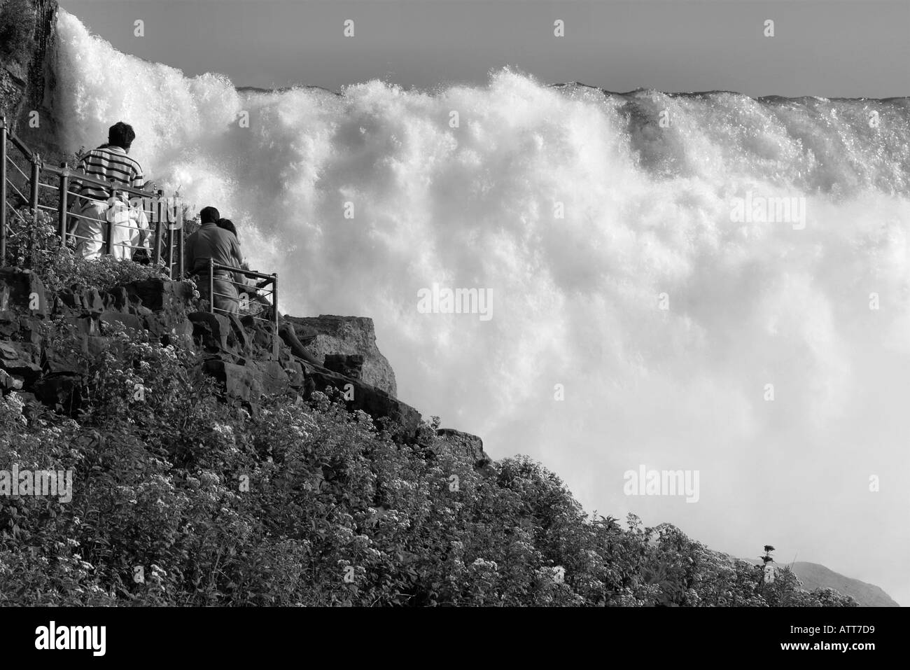 Tourists walk up the side of Niagara Falls American Falls Stock Photo