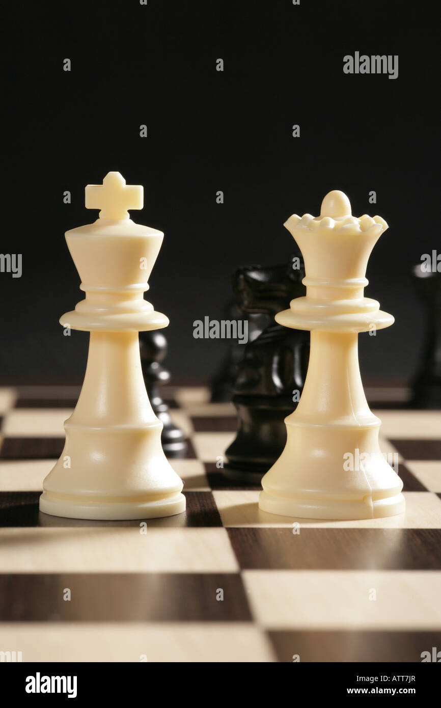 Chess pieces with black King and Queen dominant Stock Photo